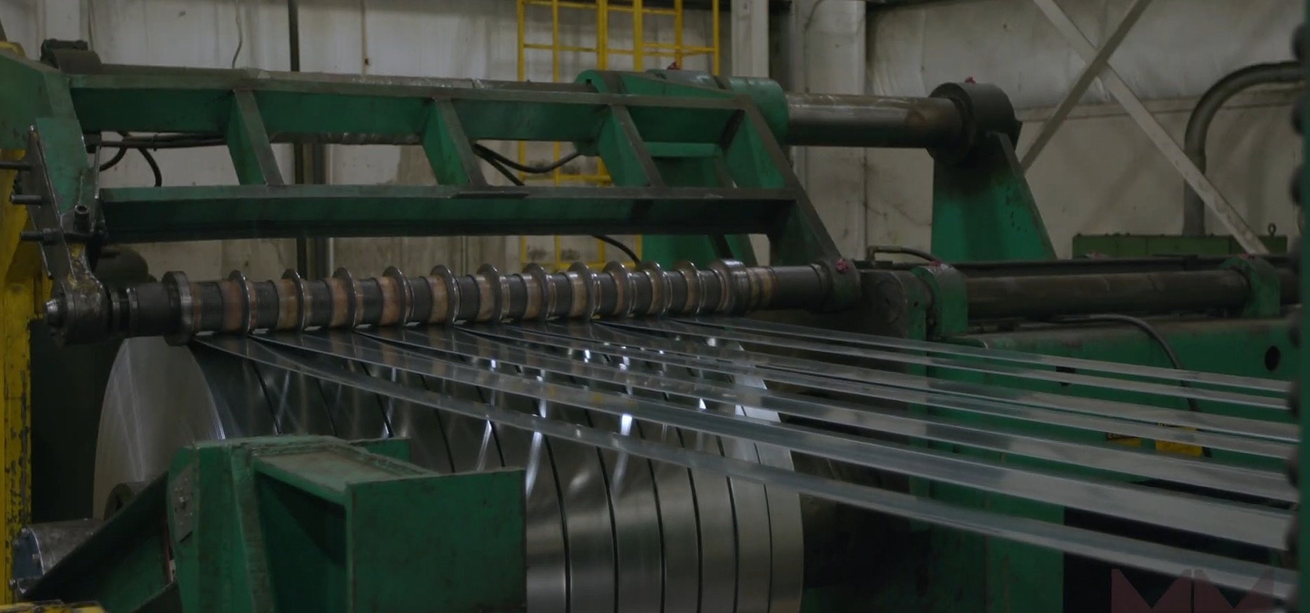 The 72-inch coil slitter in operation — multiple slit strips coming off a master coil at the Major Metals facility in Mansfield, Ohio